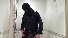 Master In Blue Jeans Washes Feet In Bathroom