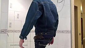 Master In Blue Jeans Washes Feet In Bathroom