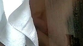 petite asian girl takes a relaxing shower at home