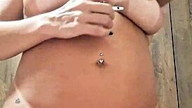 Naked milf plays with dildo in her pussy.