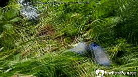 Horny chick bends over for doggystyle sex outdoors, riding cock in public sex tape.