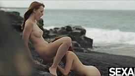 Two hot redheads dive into muff licking and nipple sucking for beach orgasm