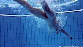 Roxalana Cheh feels the thrill as sexy redhead underwater with tight shaved ass