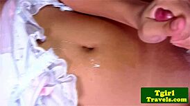 I watch the young 18+ oriental shemale masturbate in close-up.