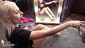 Sexy blonde works vibrator on vagina