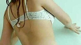 Cute Brunette In Jeans Stripteasing On Her Bed And Touching Herself Feels So Hot!