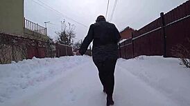 Yo, check this curvy milf's big ass in pantyhose on a snowy street!