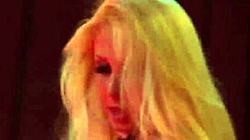 Look at this busty MILF ripping clothes on stage for a public striptease!