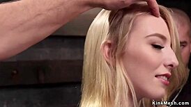 Masochistic blonde slave endures hardcore training in dark dungeon.