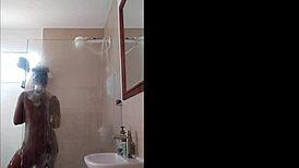 Ebony milf drops dildo in shower blowjob