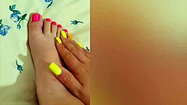 young babe strokes her sexy feet with pink pedicure, reaching luxury orgasm