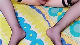 Taiwanese crossdresser in sexy stockings shows off long legs for steamy solo play. Tempting feet action included.