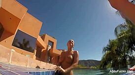 Abigail Mac Relaxes by the Pool in Nude Fun