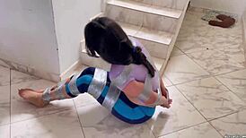 Wow, check this ball gagged girl struggling in barefoot tape bondage! 😳