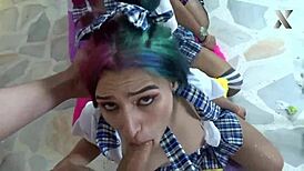 Jazmin kneels with friends, getting her throat slammed in a wild group.