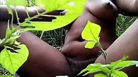 i watch this tribal african ebony fingering her pussy with toys in the woods for masturbation