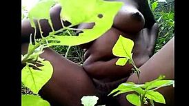 i watch this tribal african ebony fingering her pussy with toys in the woods for masturbation