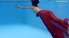 Petite brunette swims in the pool and enjoys sensual pleasures.