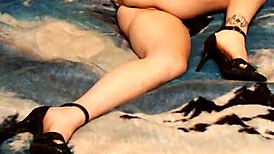 Sexy wife enjoys solo time in skirt and heels