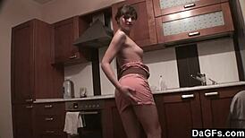 Dagfs freckled babe teases with dildo on kitchen counter