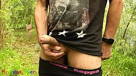 Gay guy strokes by the lake, fingering tight hole