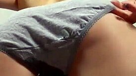 Blonde girl pees in her panties while alone at home