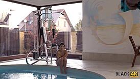 I watch the black man fuck the skinny brunette intensely by the pool.