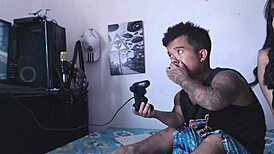 I’m so horny watching my hermanastra play with his cock while he games.