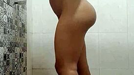 Beautiful woman gives shower to a rich man in the bathroom