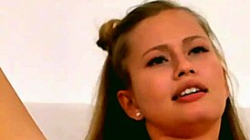 Blonde teen touches her big tits and masturbates on camera