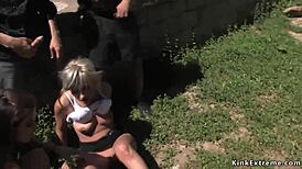 handcuffed blonde outdoors in voyeur scene