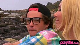 blonde pornstar bends over for quickie doggystyle blowjob on the rocky outdoor beach