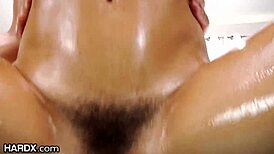 Keisha Grey enjoys a deep anal penetration in her oiled up ass