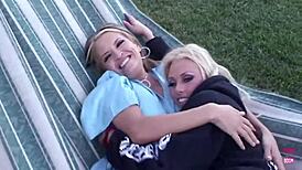 these brunette lesbians are fucking each other with strapons