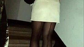 Hey, check out this leather catsuit with pantyhose and miniskirt combo.