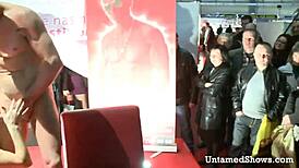 Hot nurse strips and swallows cock on stage