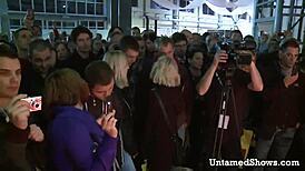 Hot nurse strips and swallows cock on stage