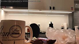 Young amateur wife washes dishes while voyeur camera records