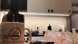 Young amateur wife washes dishes while voyeur camera records