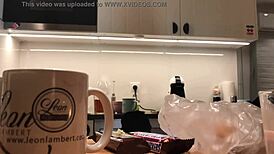 Young amateur wife washes dishes while voyeur camera records