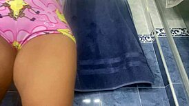 Stepmother with a big ass caught urinating in the bathroom