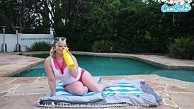 i'm a blonde hot milf oiling up my big tits and masturbating pussy by the pool for orgasm