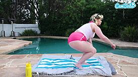 i'm a blonde hot milf oiling up my big tits and masturbating pussy by the pool for orgasm