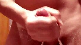 A skinny European teen jerks off a huge cock and cums heavily