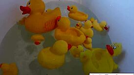 Sexy Nadia Enjoys a Relaxing Bath with Playful Rubber Duckies.