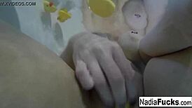 Sexy Nadia Enjoys a Relaxing Bath with Playful Rubber Duckies.