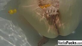 Sexy Nadia Enjoys a Relaxing Bath with Playful Rubber Duckies.