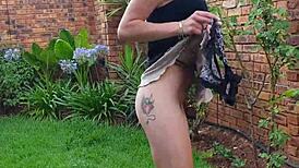 This skinny little girl pisses in the garden. Then she twerks her tiny ass for fun