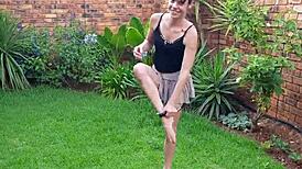 This skinny little girl pisses in the garden. Then she twerks her tiny ass for fun