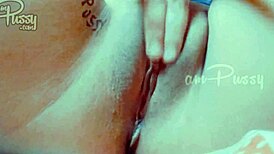 She fingers her shaved pussy closeup